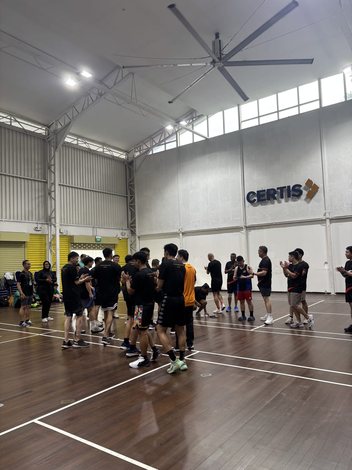 A company team playing captain's ball at their own sports hall
