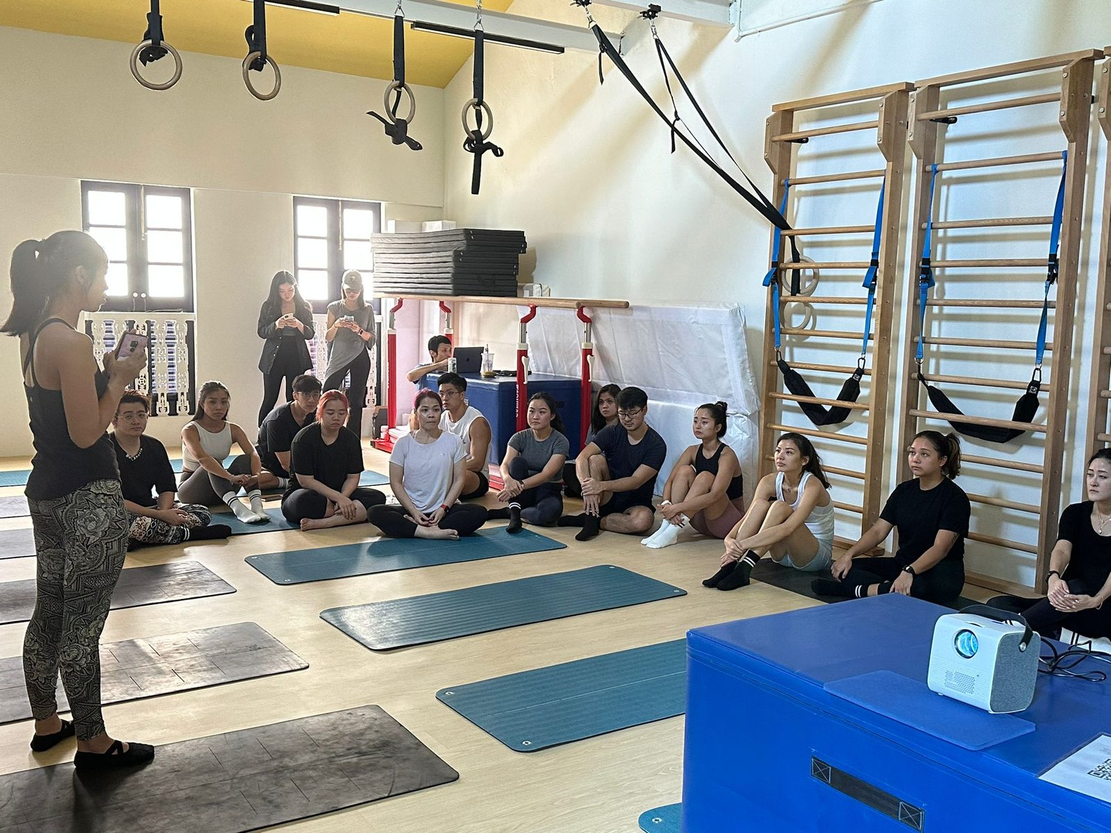 A group pilates session led by an instructor