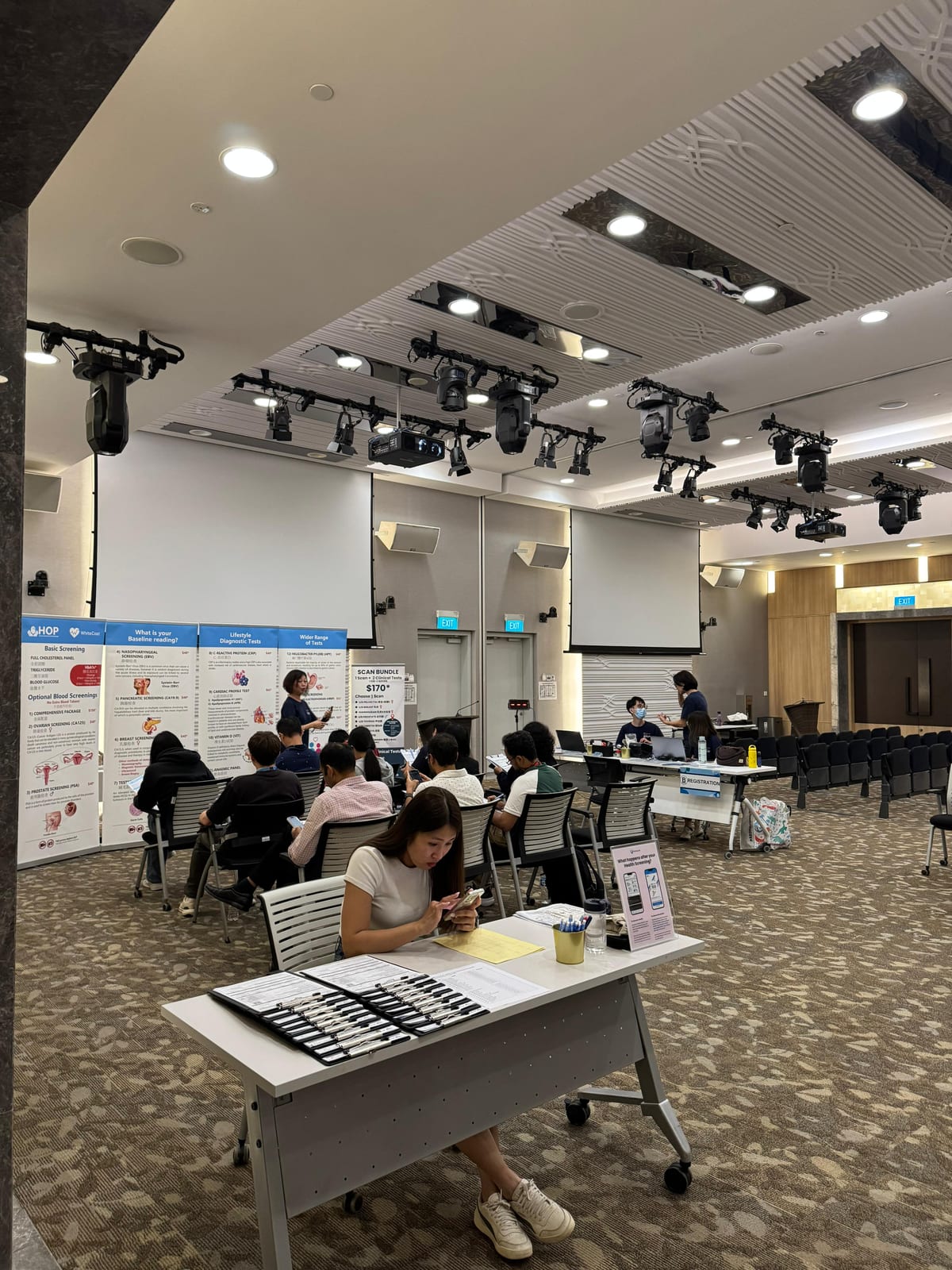 Health screening stations set up in a company function hall