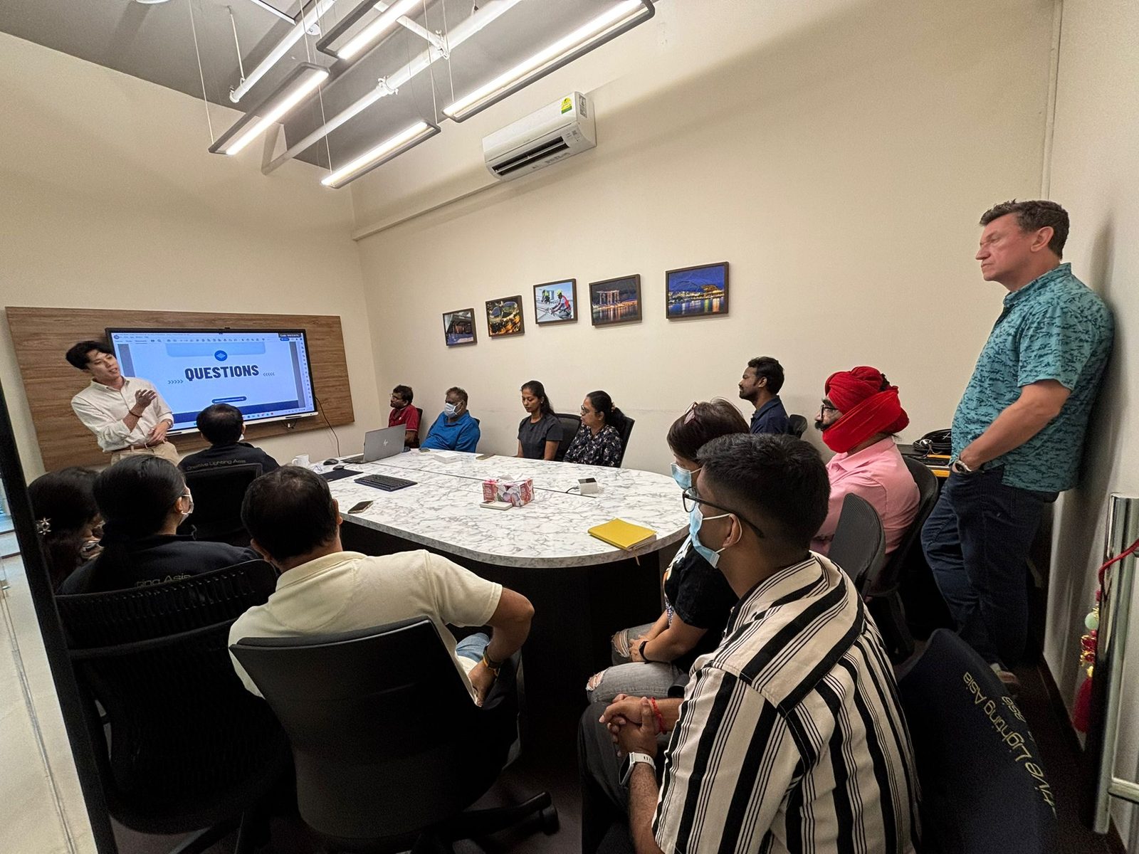 A chiropractor presenting to employees at Creative Lighting