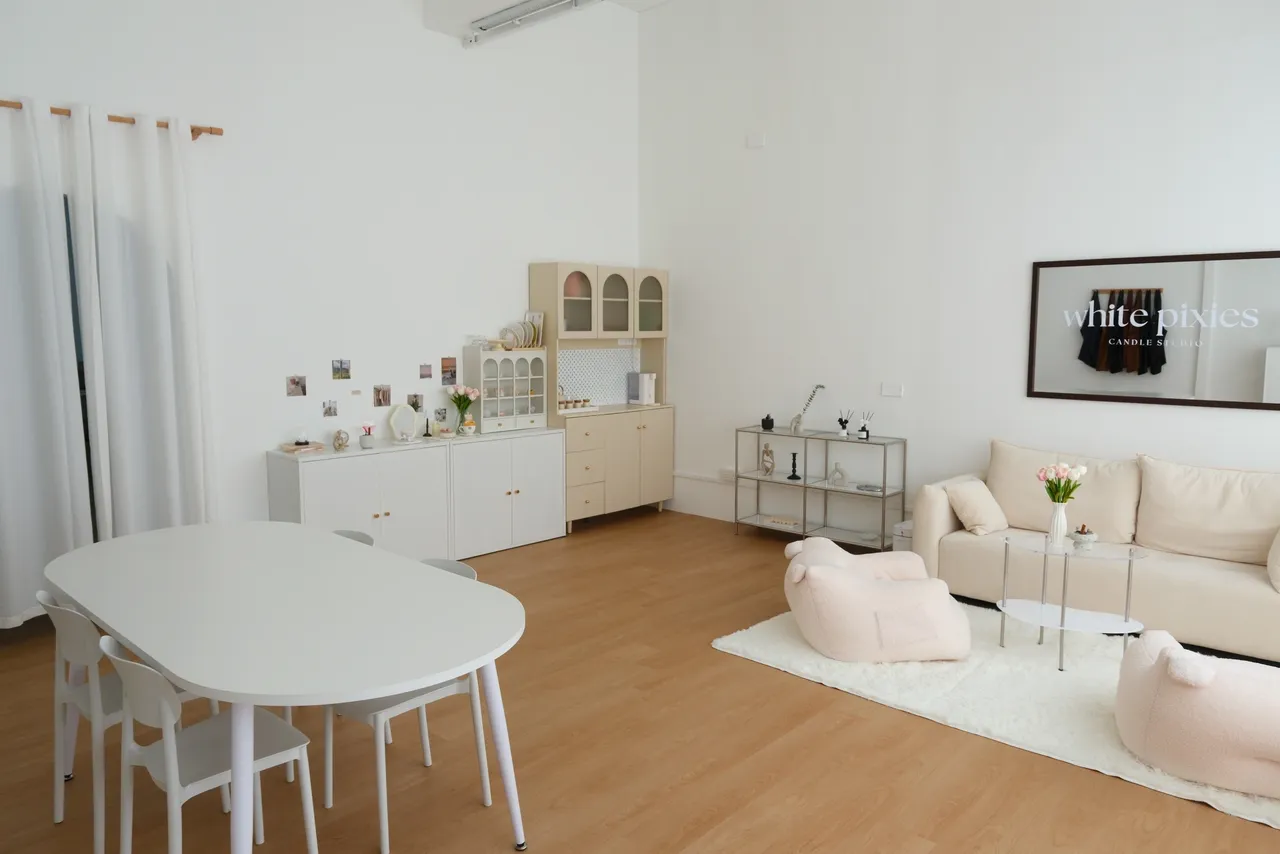 White Pixies Studio: a bright minimal room with a central table